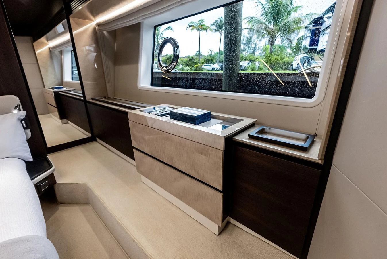 The yacht's interior features a sleek and modern design with ample storage and large windows providing natural light. aboard CLASS DISMISSED Yacht for Sale
