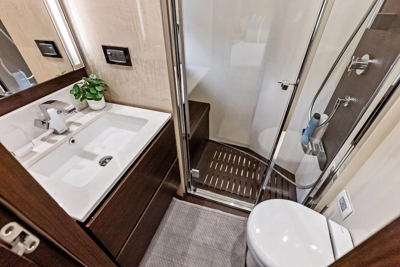 The yacht's bathroom features modern fixtures and a sleek design. aboard CLASS DISMISSED Yacht for Sale