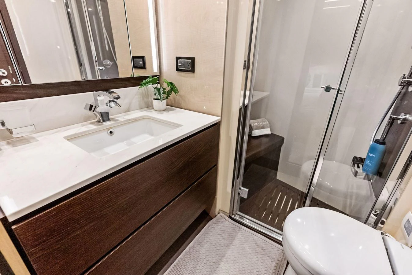 The yacht's bathroom features modern fixtures and a sleek design. aboard CLASS DISMISSED Yacht for Sale