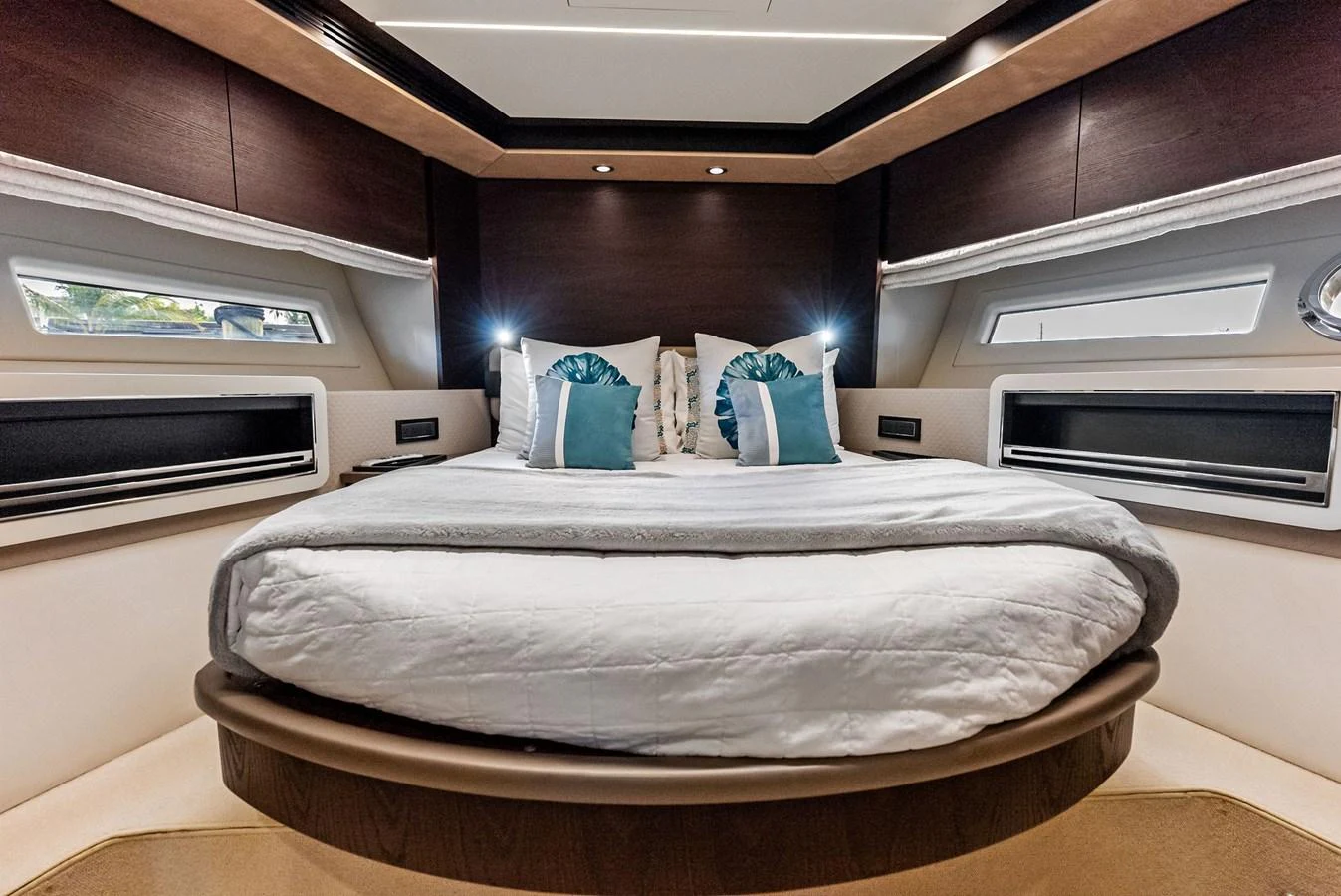 The master stateroom offers a luxurious and cozy retreat with elegant bedding and ambient lighting. aboard CLASS DISMISSED Yacht for Sale
