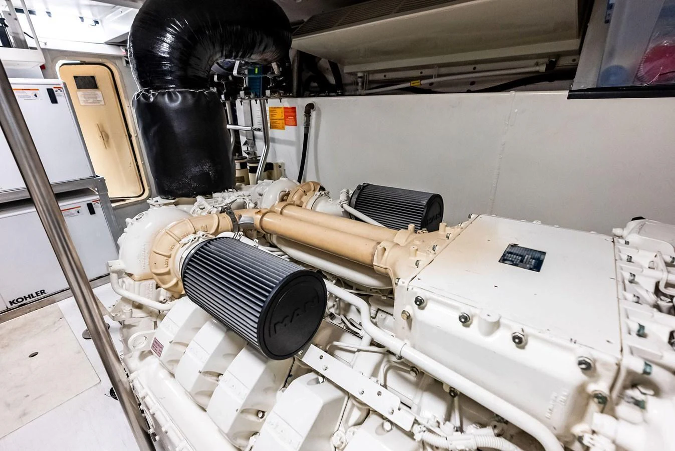 The yacht's engine room showcases powerful and well-maintained machinery. aboard CLASS DISMISSED Yacht for Sale