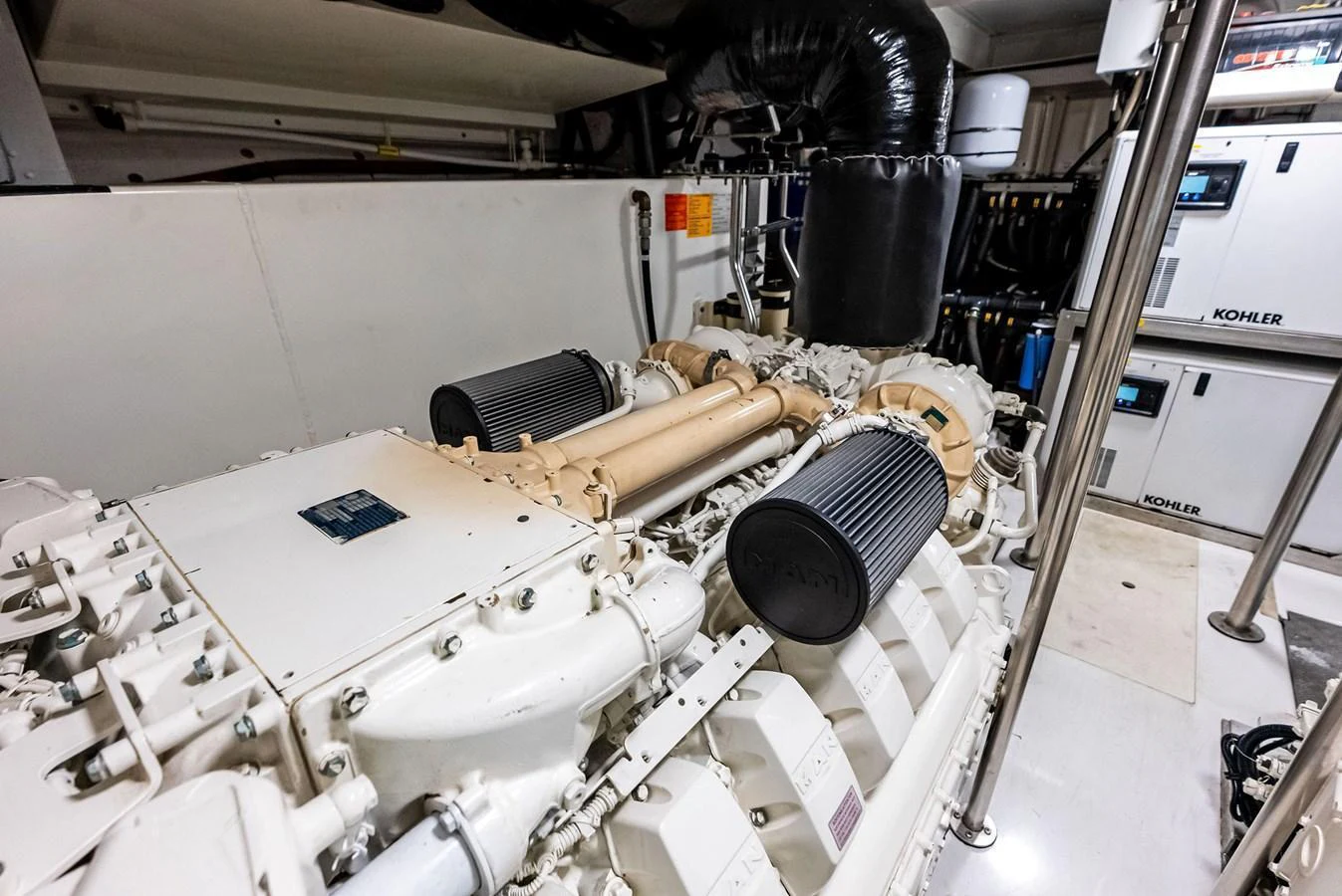 The image showcases the yacht's well-maintained engine room with high-quality machinery. aboard CLASS DISMISSED Yacht for Sale