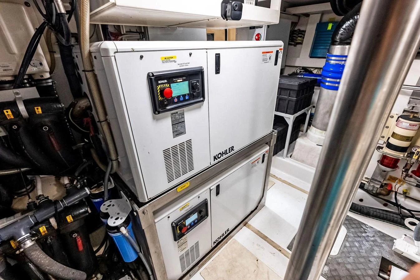 The image showcases the technical equipment and machinery in the yacht's engine room. aboard CLASS DISMISSED Yacht for Sale