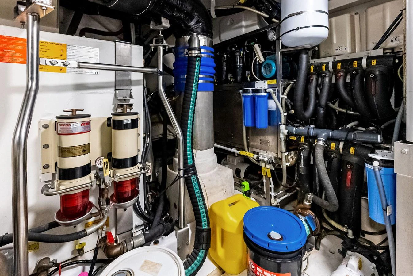 The image showcases the yacht's well-organized engine room with various mechanical components and systems. aboard CLASS DISMISSED Yacht for Sale