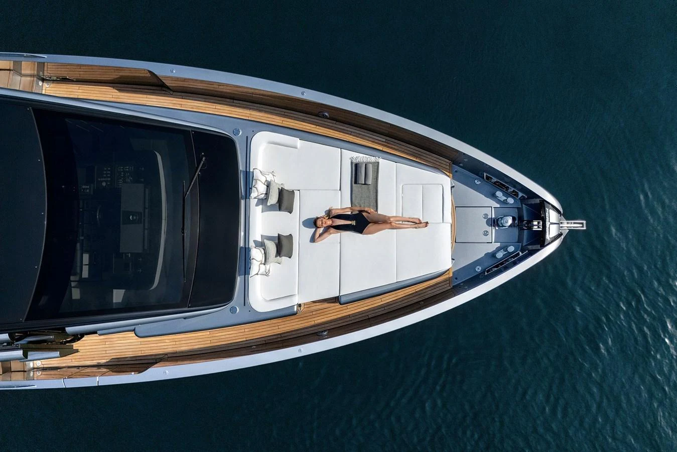 A luxurious foredeck with sunbathing area on a sleek yacht, captured from above. aboard GTX70 Yacht for Sale