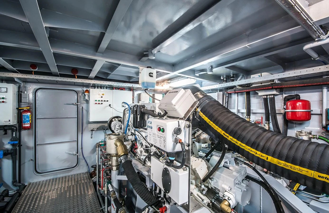 The image showcases a well-organized and clean engine room with modern equipment. aboard 20 YXT Yacht for Sale