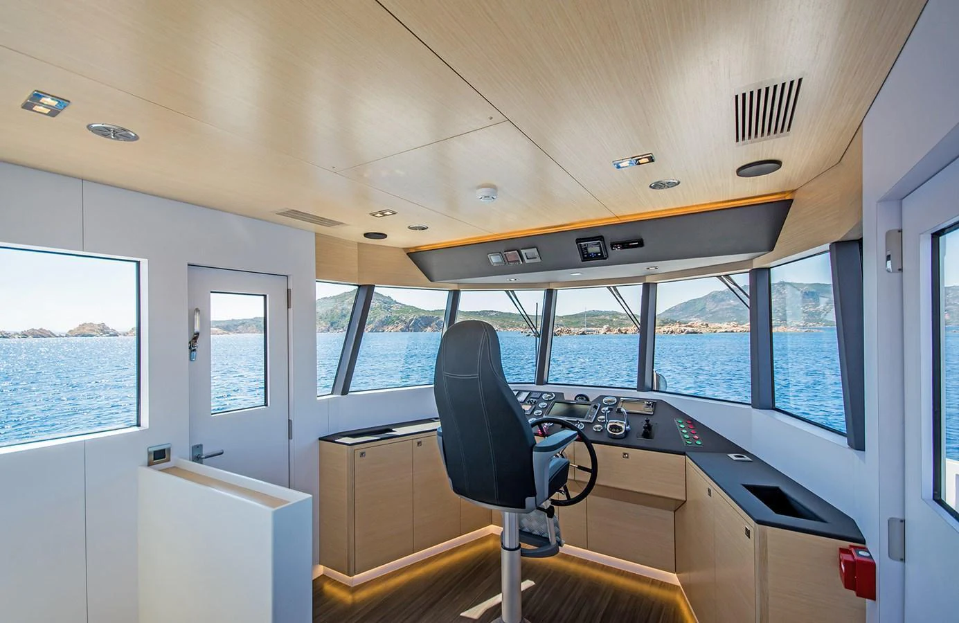 The helm station offers panoramic views and modern navigation equipment. aboard 20 YXT Yacht for Sale