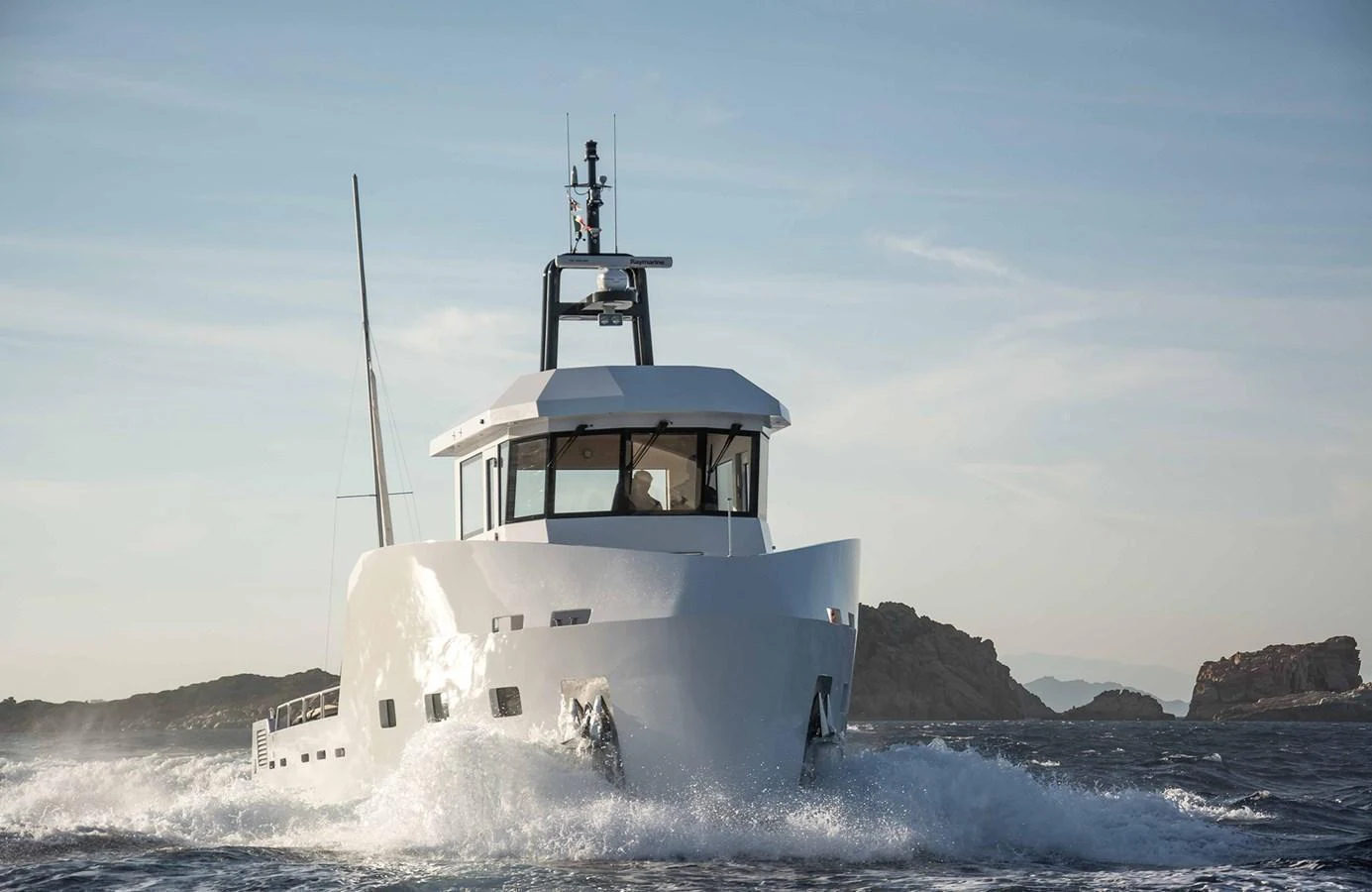 A modern yacht navigates through the open sea, showcasing its sleek design and sturdy build. aboard 20 YXT Yacht for Sale