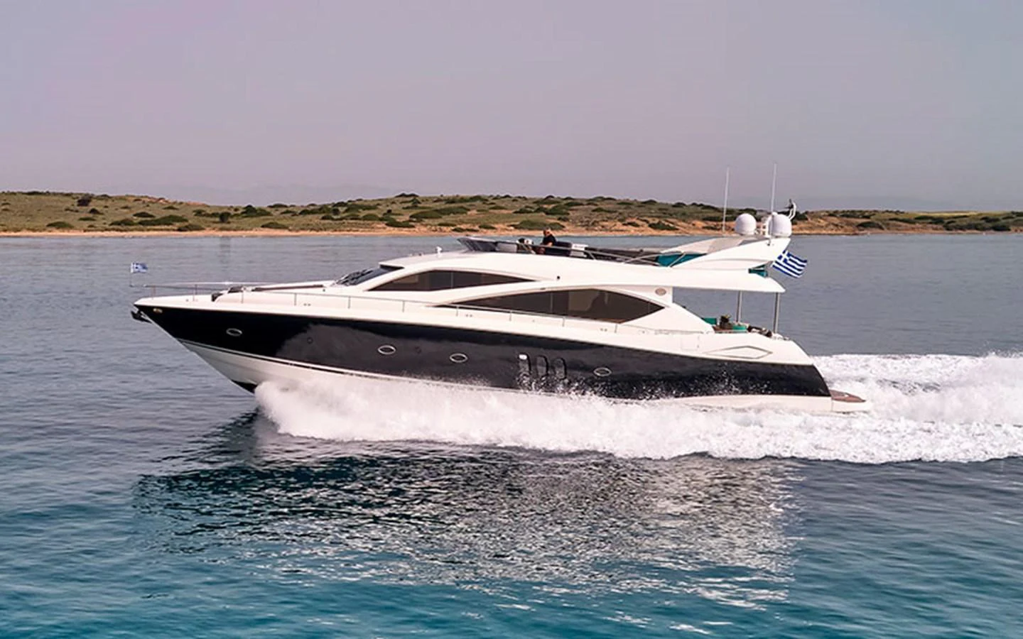 A sleek yacht glides effortlessly over calm waters, showcasing its modern design and luxurious appeal. aboard M FIVE Yacht for Sale