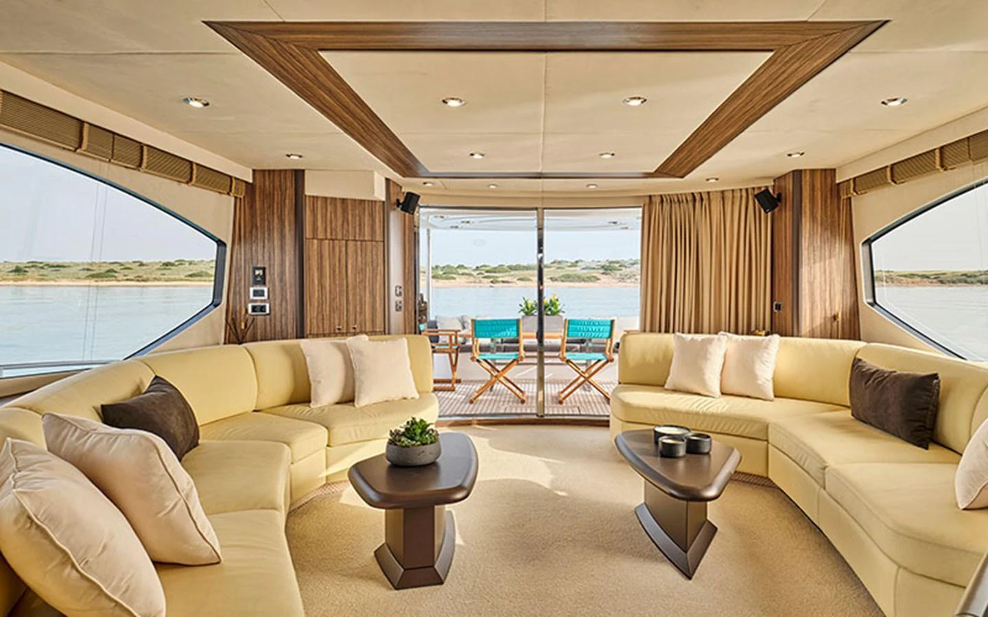The salon features plush seating and a serene view through large windows. aboard M FIVE Yacht for Sale