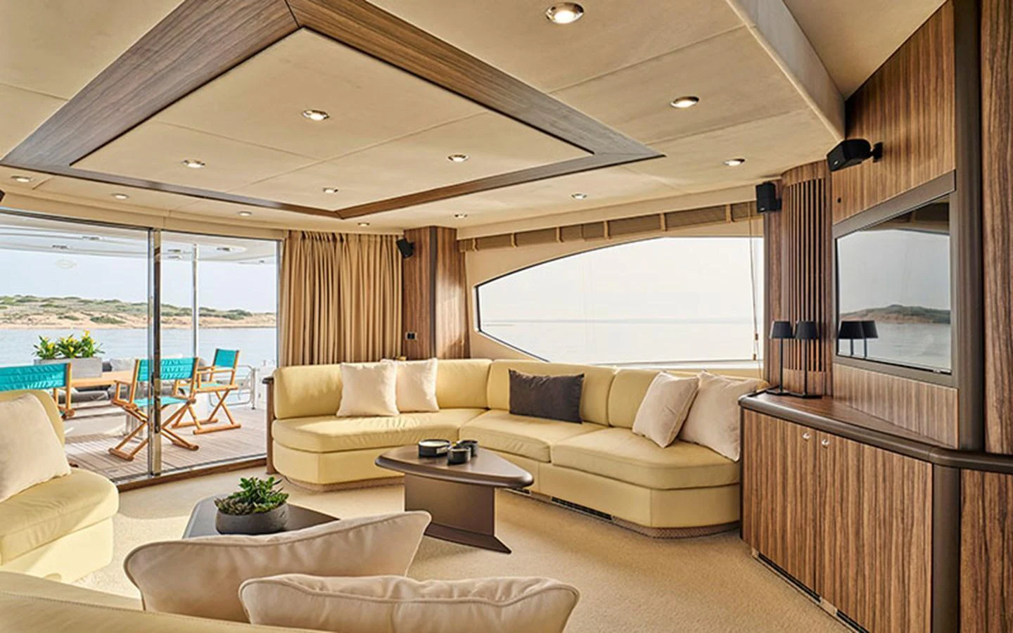 The salon offers a spacious and elegant seating area with a view of the sea through large windows. aboard M FIVE Yacht for Sale