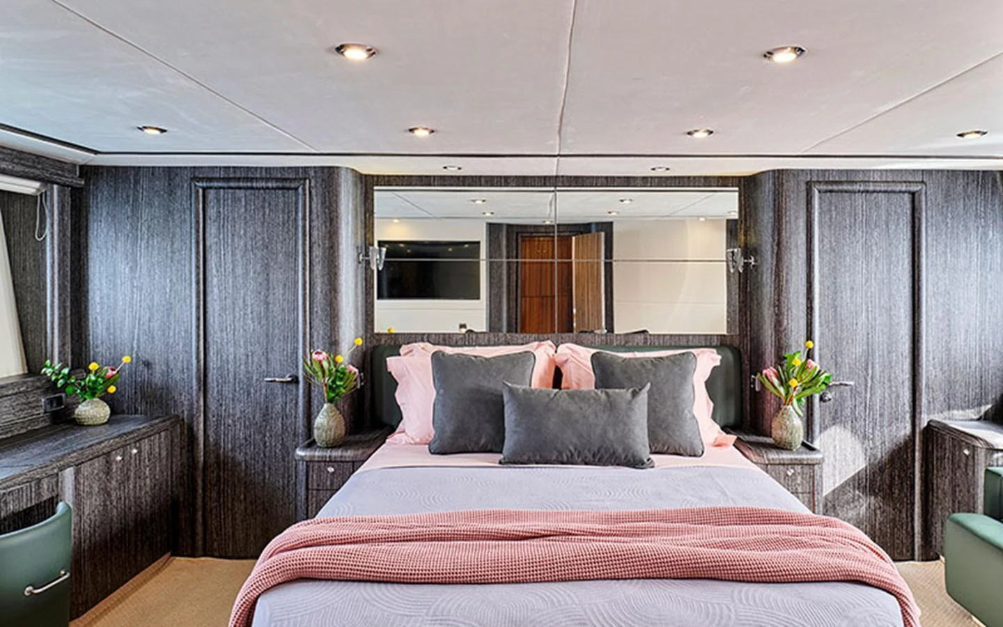 The master stateroom features a luxurious bed with elegant decor and ample natural light. aboard M FIVE Yacht for Sale