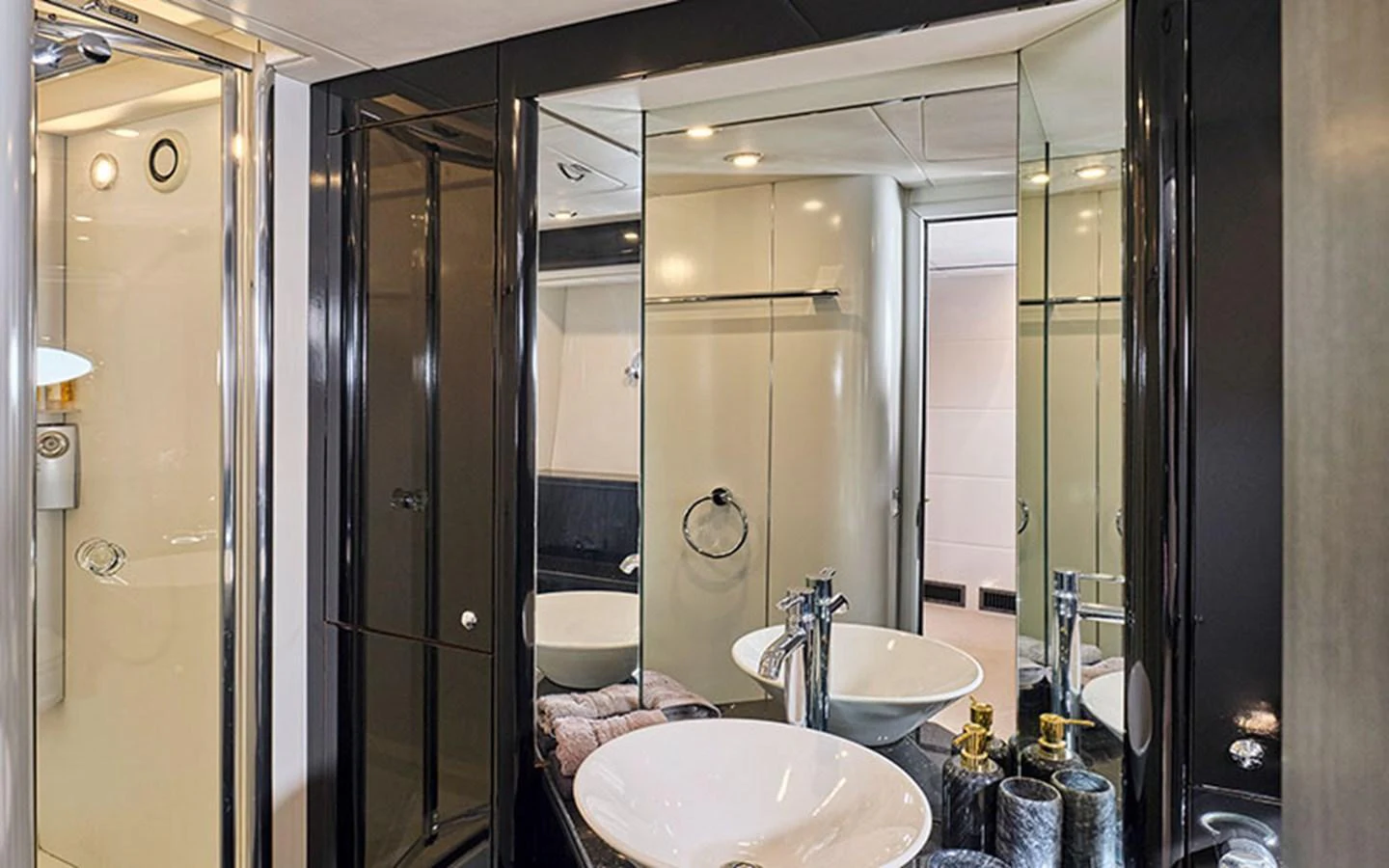 The yacht's bathroom features modern fixtures and a sleek design with ample mirrors. aboard M FIVE Yacht for Sale
