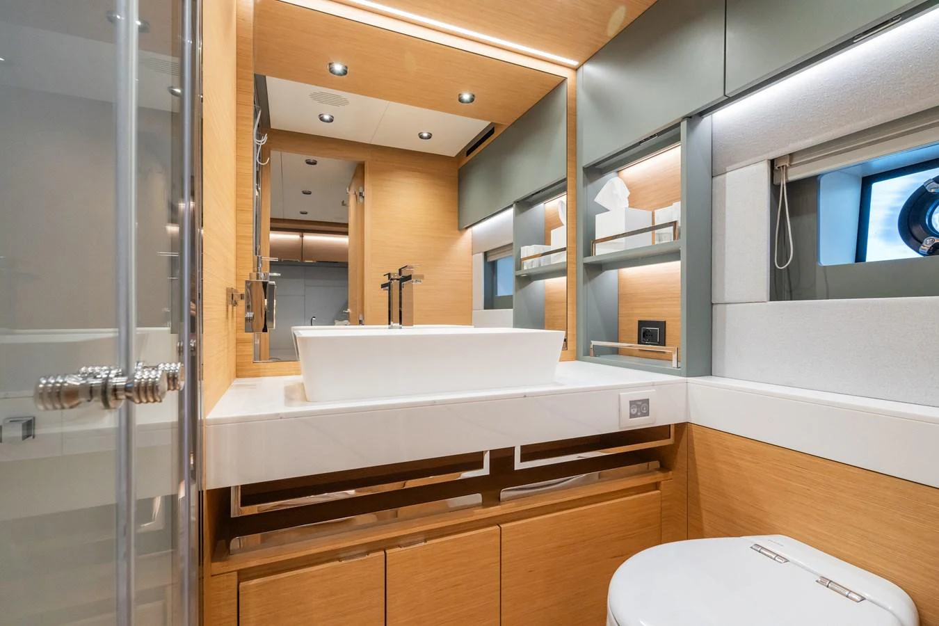 The yacht's bathroom features modern fixtures and a sleek design with ample lighting. aboard SIMON Yacht for Sale