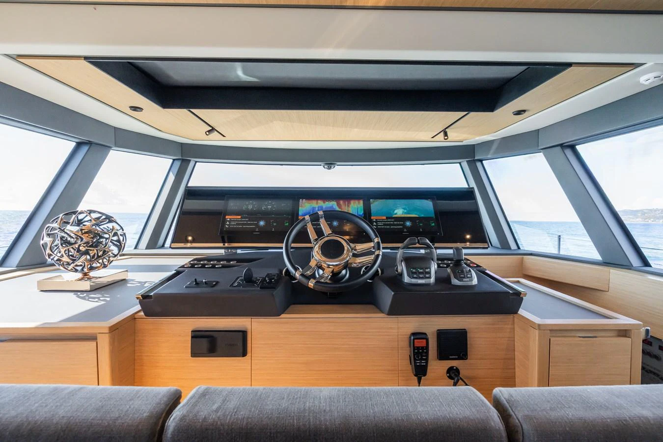 The helm station features state-of-the-art navigation equipment and a sleek, modern design. aboard SIMON Yacht for Sale