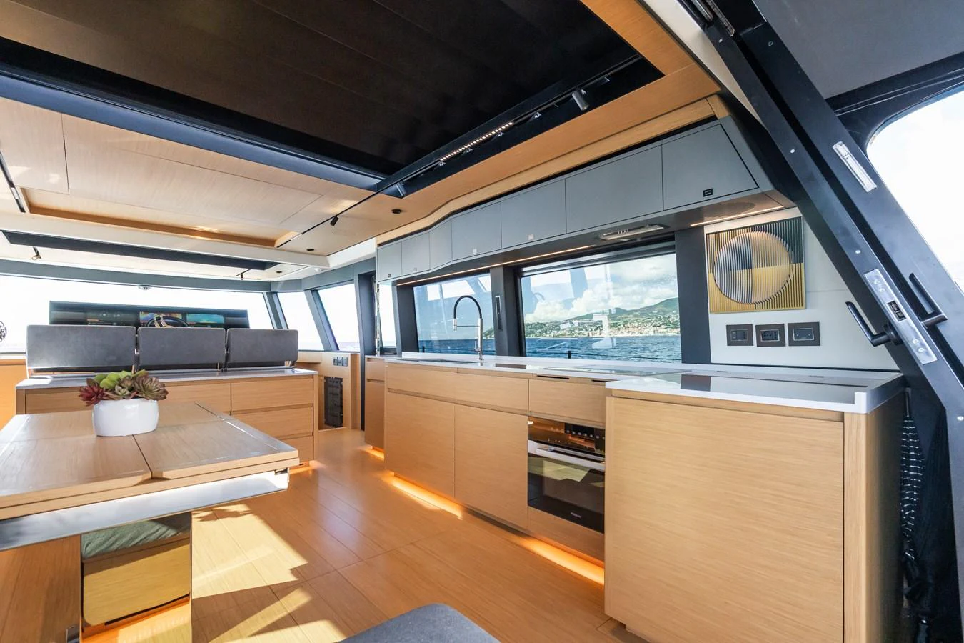 The yacht's galley features modern appliances and ample natural light, creating a bright and inviting space. aboard SIMON Yacht for Sale
