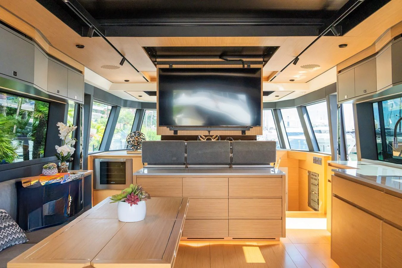 The yacht's salon features modern furnishings and large windows for ample natural light. aboard SIMON Yacht for Sale