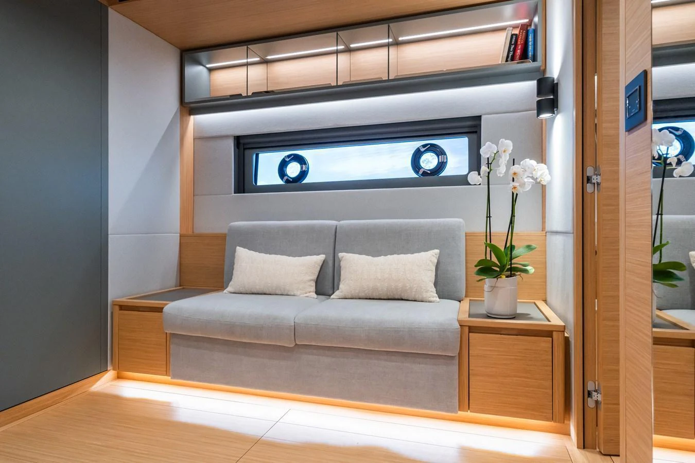The yacht's salon features a cozy seating area with modern decor and ambient lighting. aboard SIMON Yacht for Sale