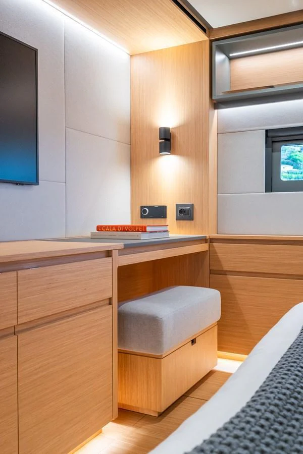 A cozy stateroom with modern wooden cabinetry and soft lighting. aboard SIMON Yacht for Sale