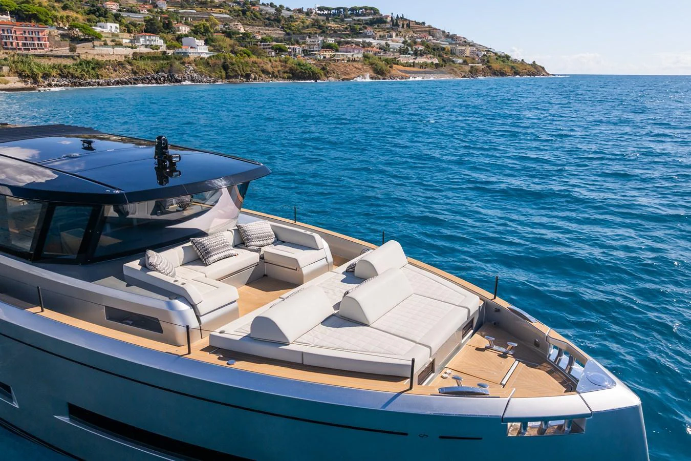 The yacht's foredeck features luxurious sunbeds and a sleek design, perfect for relaxation while cruising. aboard SIMON Yacht for Sale