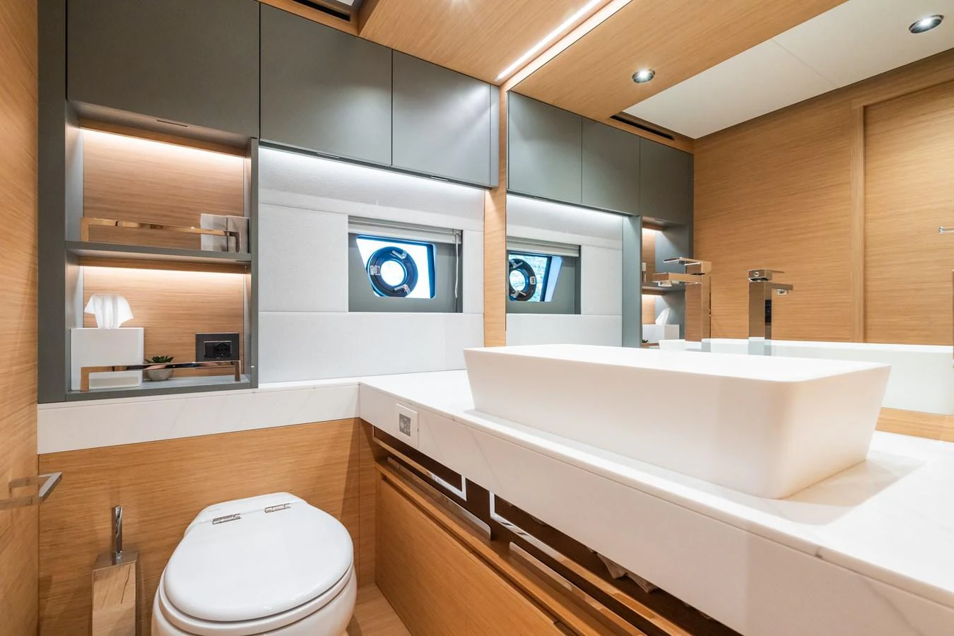 A modern and sleek yacht bathroom with elegant fixtures and ample lighting. aboard SIMON Yacht for Sale