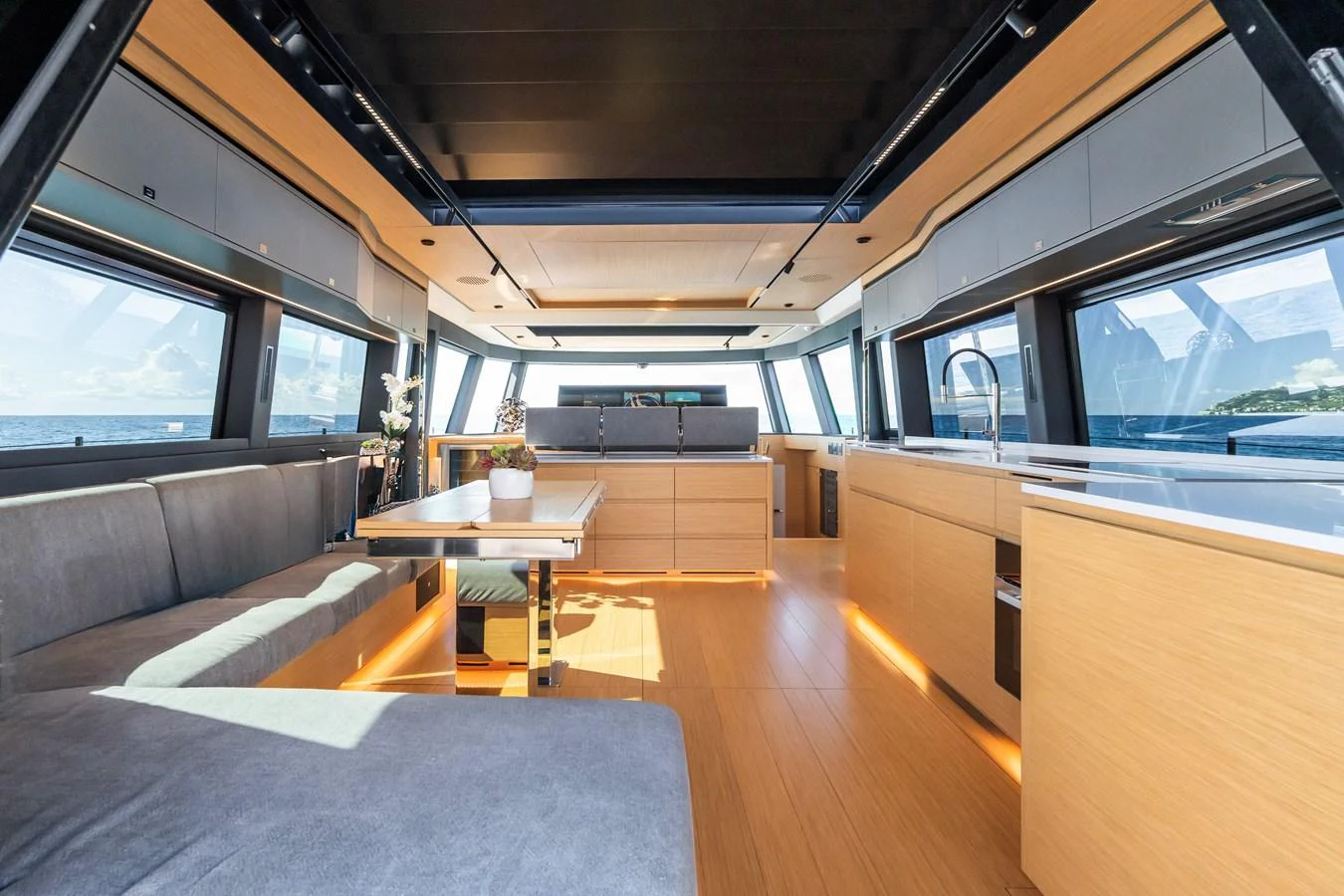 The salon features modern furnishings with ample natural light and panoramic views. aboard SIMON Yacht for Sale