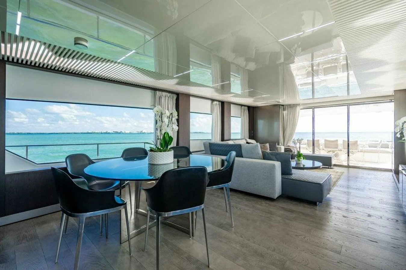 a room with a table and chairs aboard 85 FERRETTI Yacht for Sale