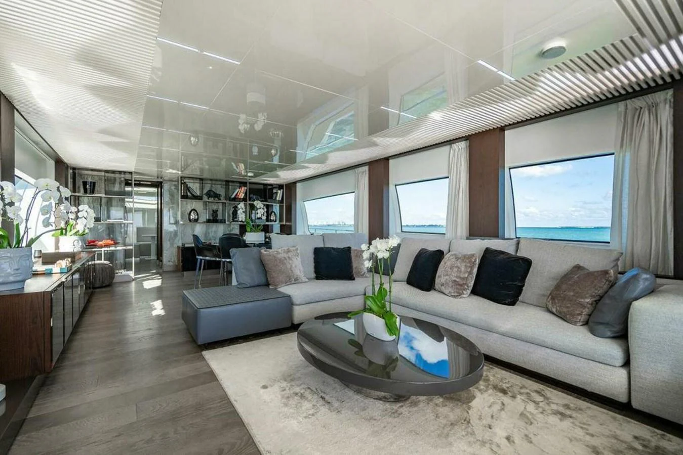 a living room with a couch and a coffee table aboard 85 FERRETTI Yacht for Sale