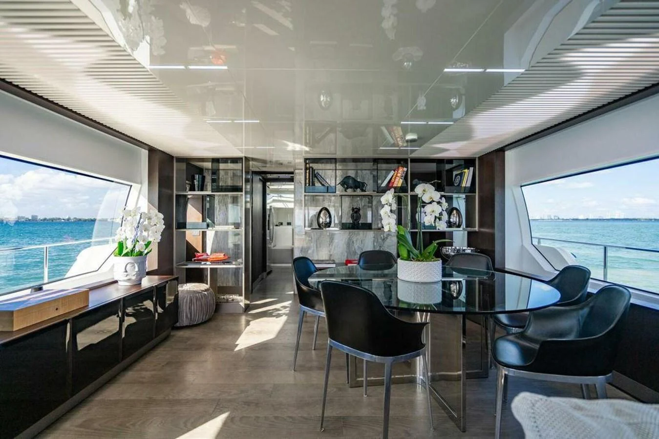 a room with a table chairs and a window aboard 85 FERRETTI Yacht for Sale