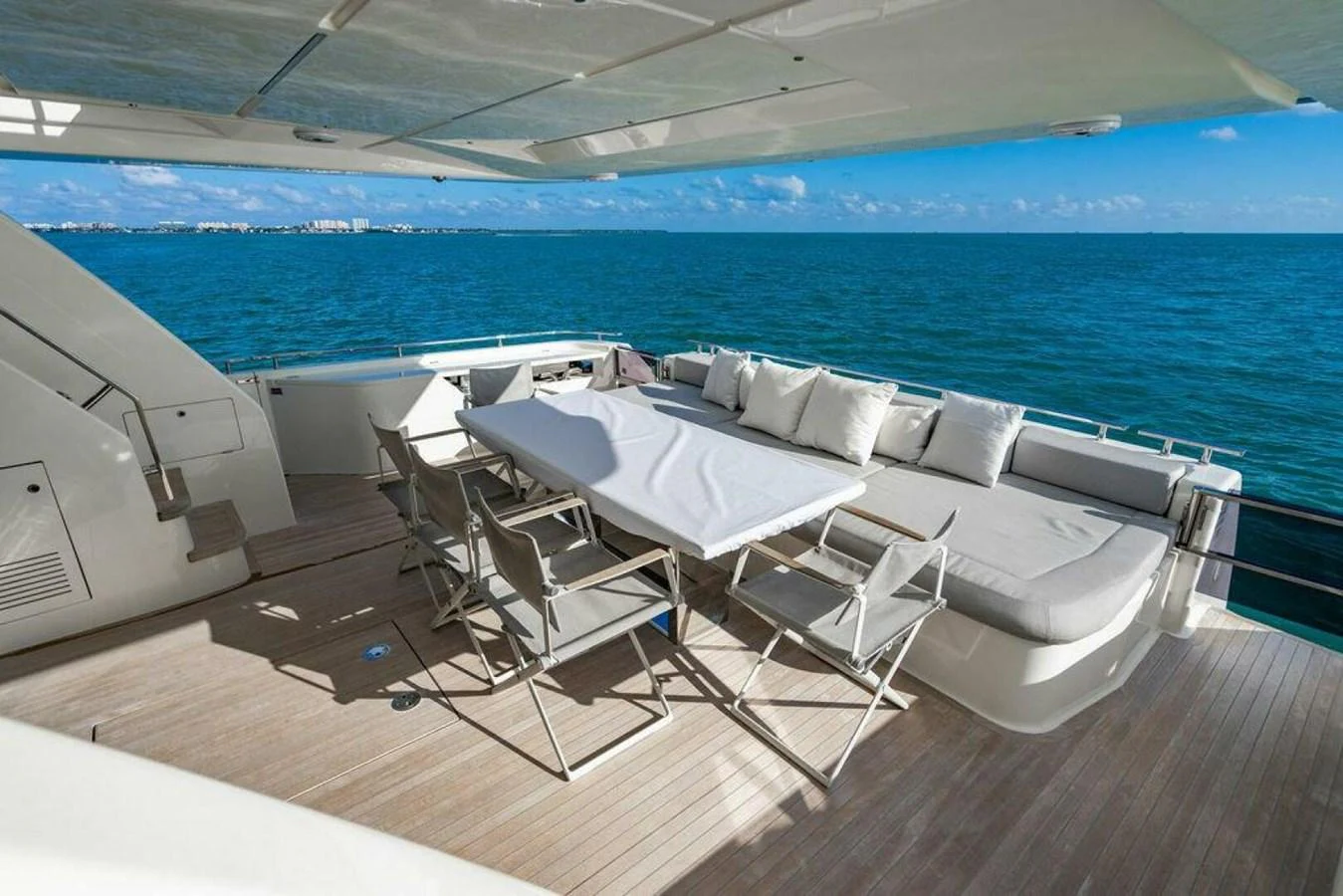 a room with chairs and a pool aboard 85 FERRETTI Yacht for Sale