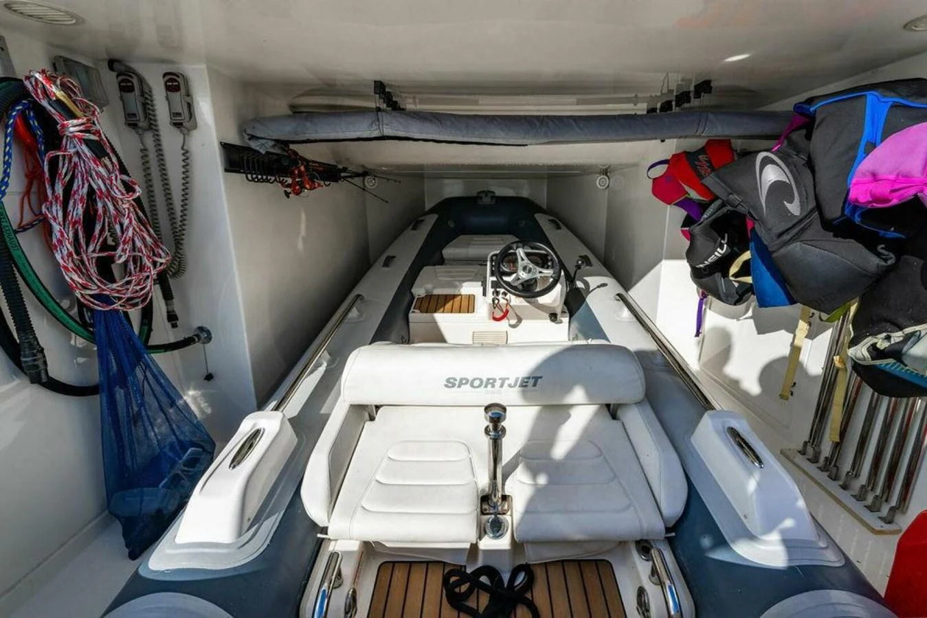 a car with a hood open aboard 85 FERRETTI Yacht for Sale