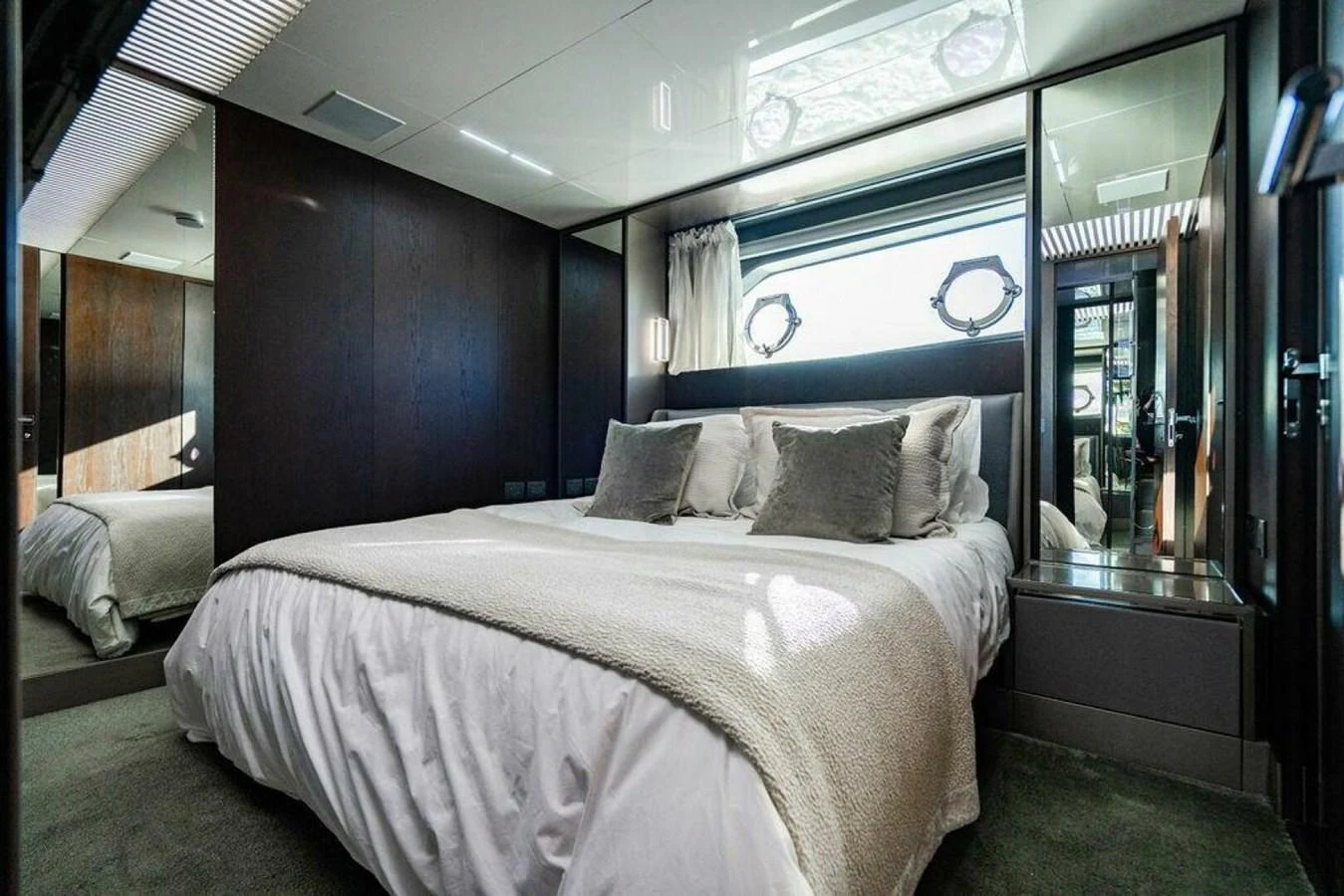 a bed with a white bed spread aboard 85 FERRETTI Yacht for Sale