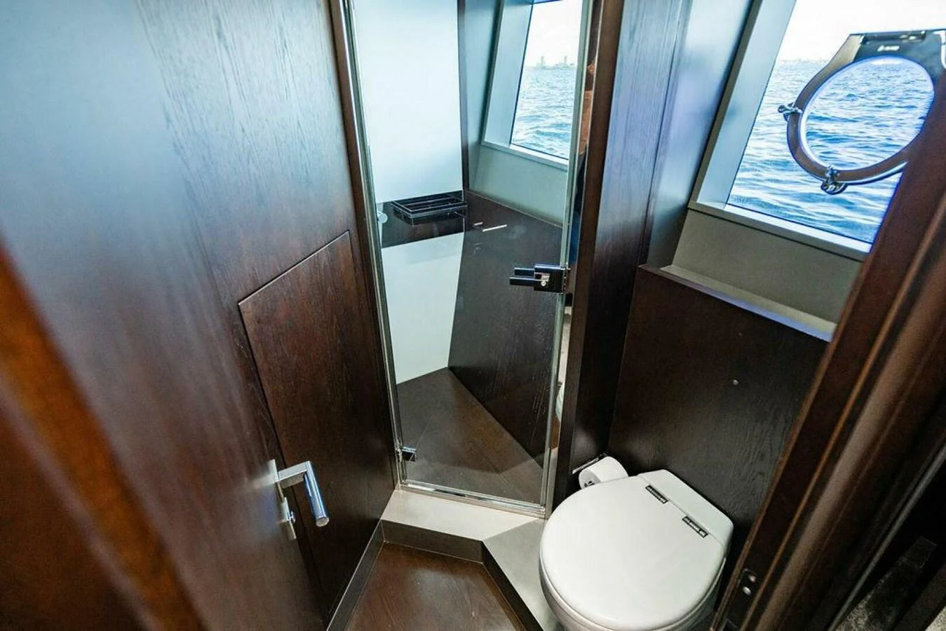 a bathroom with a toilet and a mirror aboard 85 FERRETTI Yacht for Sale