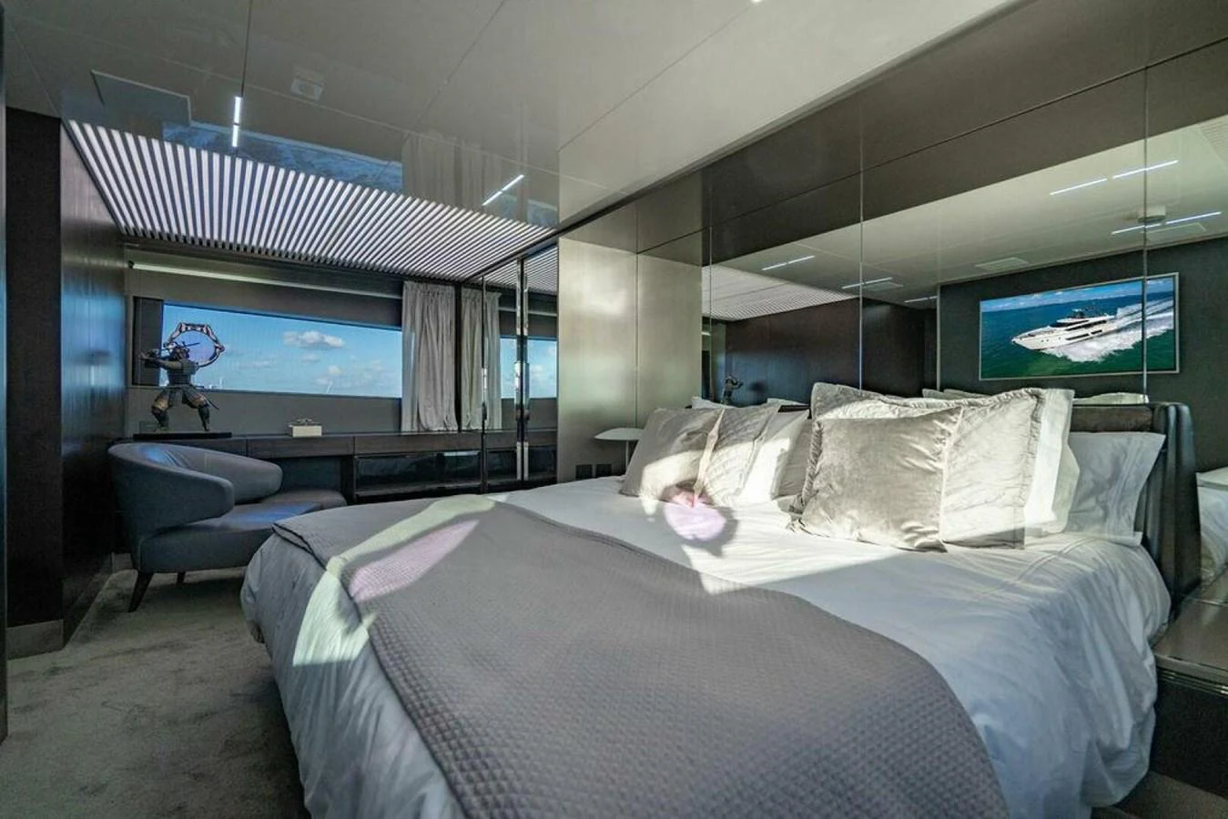 a bedroom with a large bed aboard 85 FERRETTI Yacht for Sale