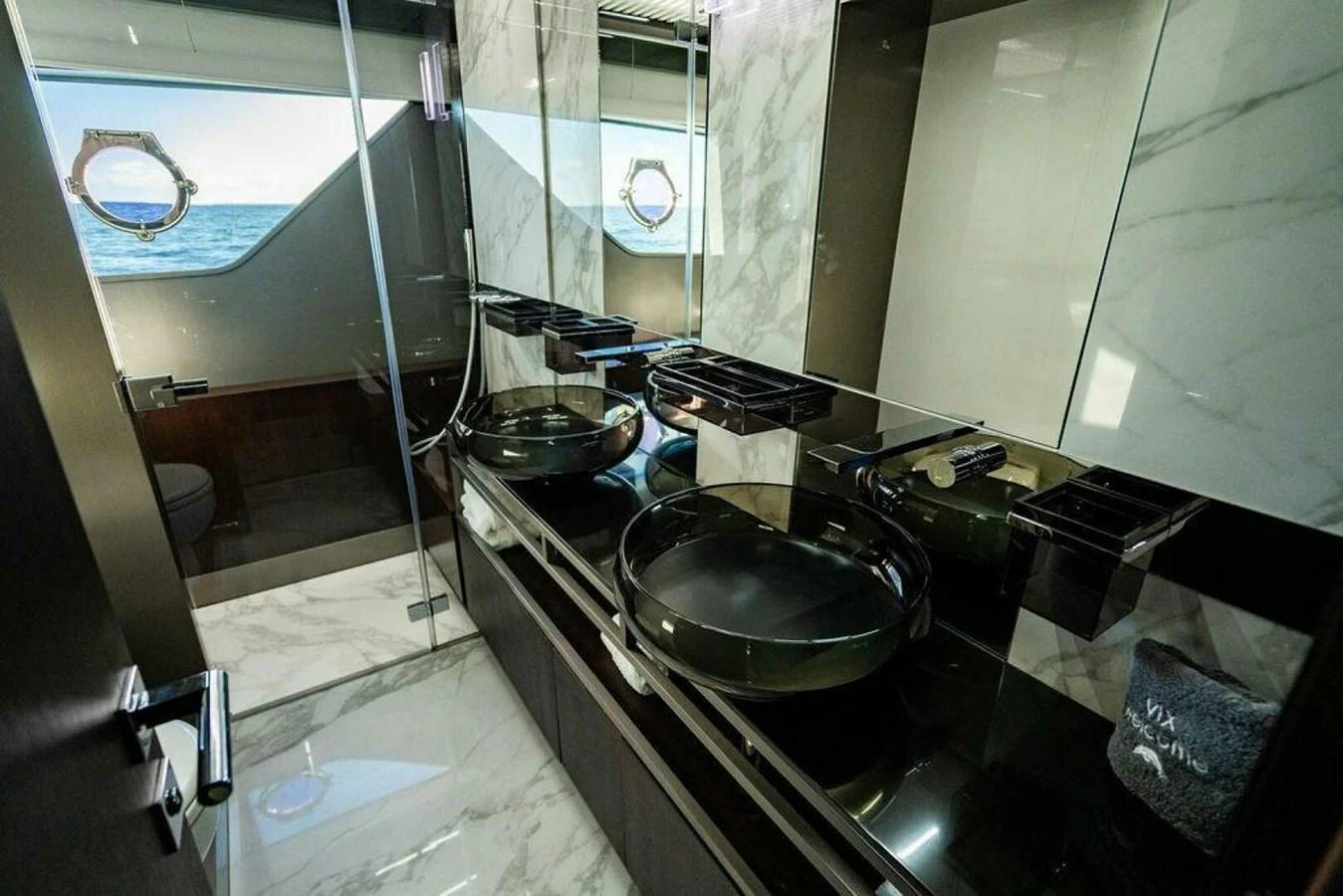 a kitchen with a sink and a mirror aboard 85 FERRETTI Yacht for Sale