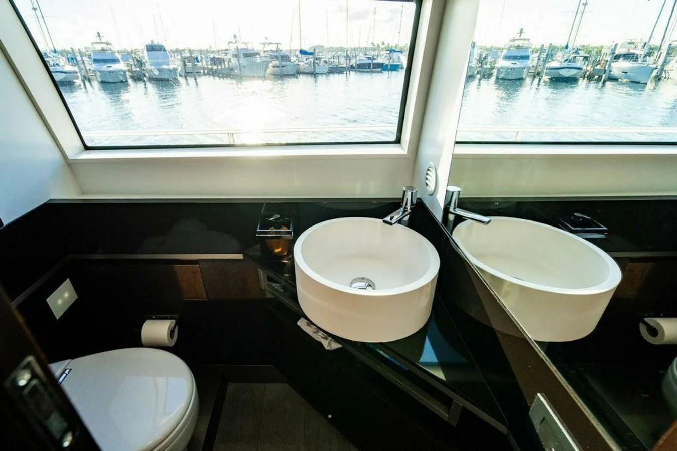 a bathroom with a sink and a toilet aboard 85 FERRETTI Yacht for Sale