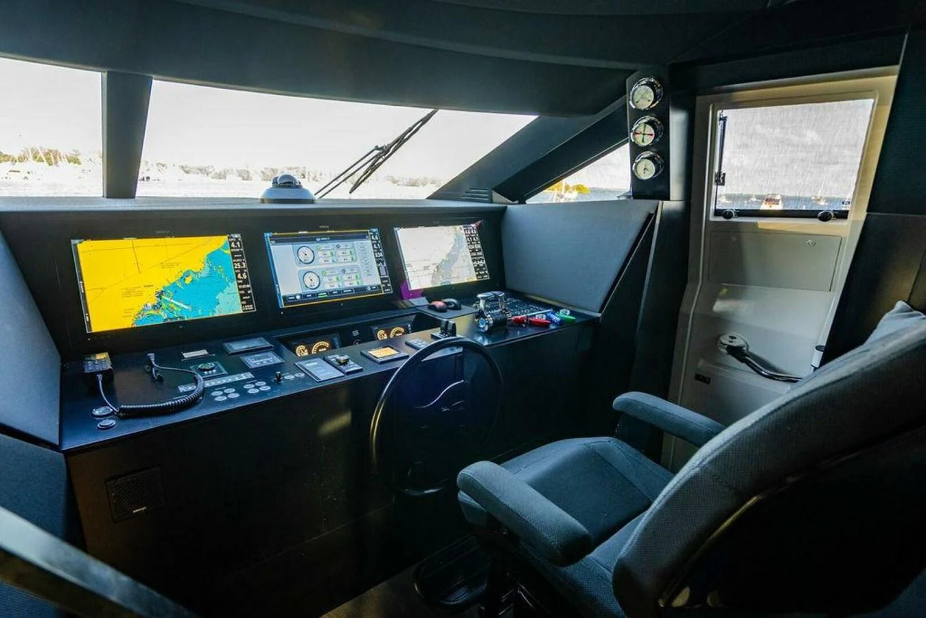 a room with computers and monitors aboard 85 FERRETTI Yacht for Sale