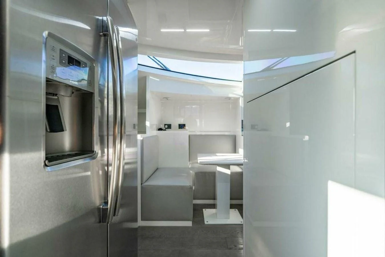 a room with a few chairs and a table aboard 85 FERRETTI Yacht for Sale