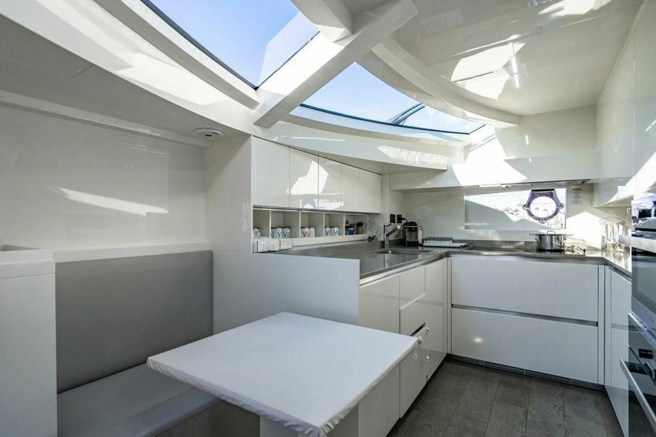 a kitchen with white cabinets aboard 85 FERRETTI Yacht for Sale