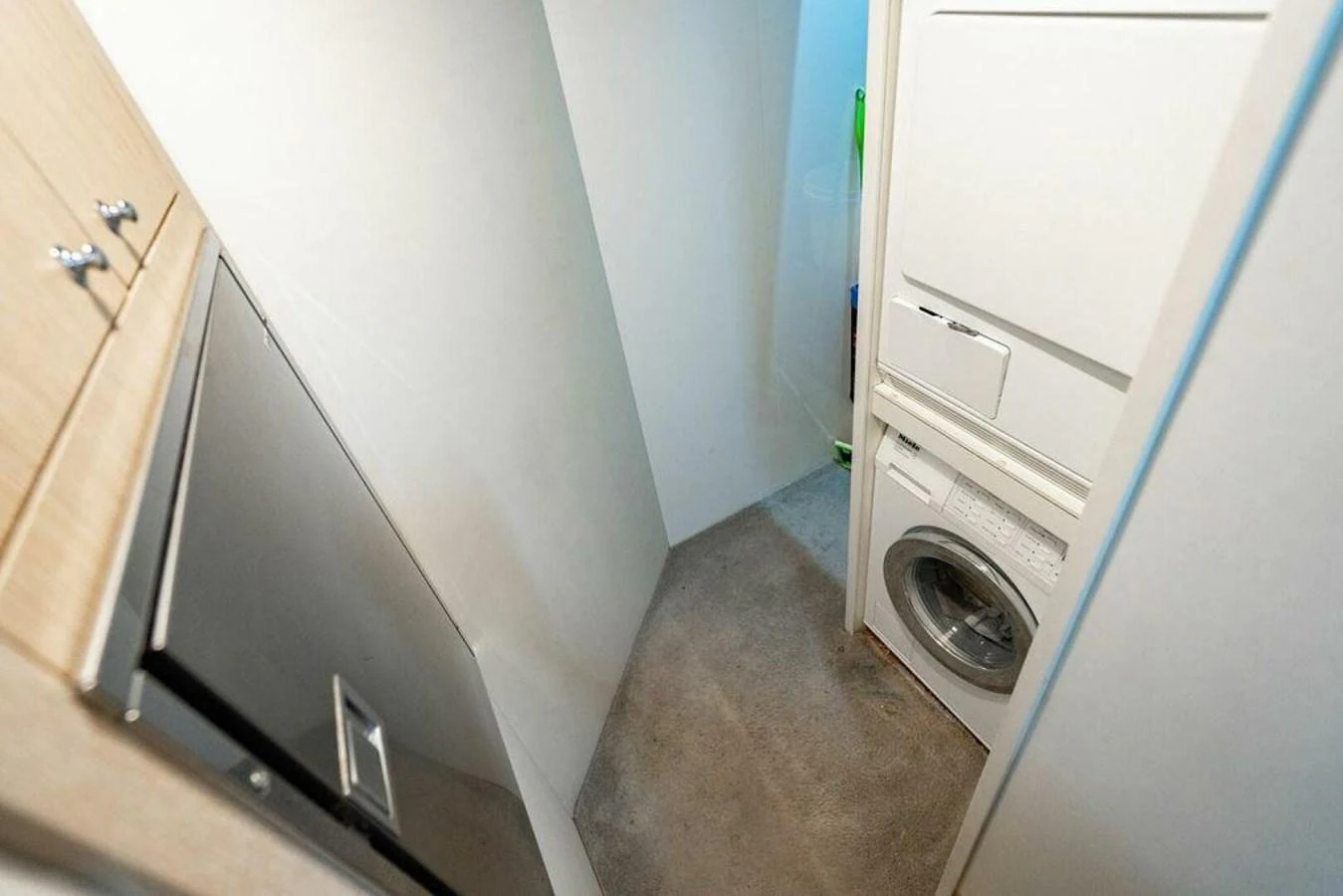 a washer and dryer in a room aboard 85 FERRETTI Yacht for Sale
