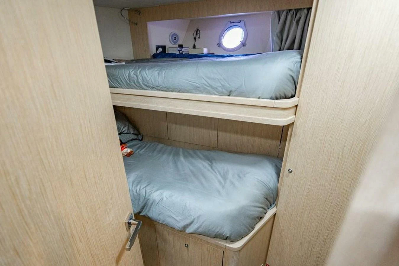 a bed with a television on the wall aboard 85 FERRETTI Yacht for Sale