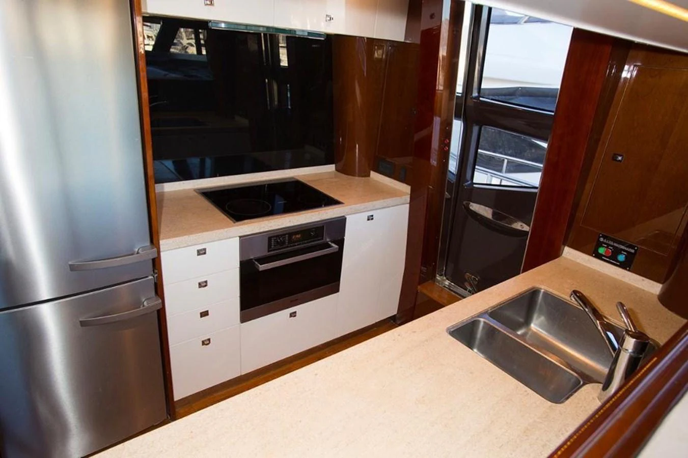 The galley features modern appliances and sleek countertops, perfect for gourmet cooking on the water. aboard RAINBOW Yacht for Sale
