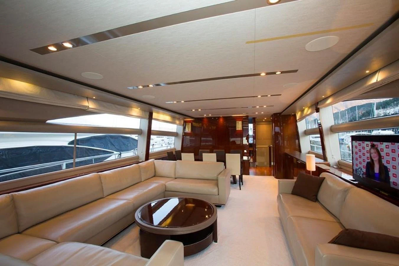 The spacious salon features luxurious seating and modern decor, perfect for relaxation and entertainment. aboard RAINBOW Yacht for Sale