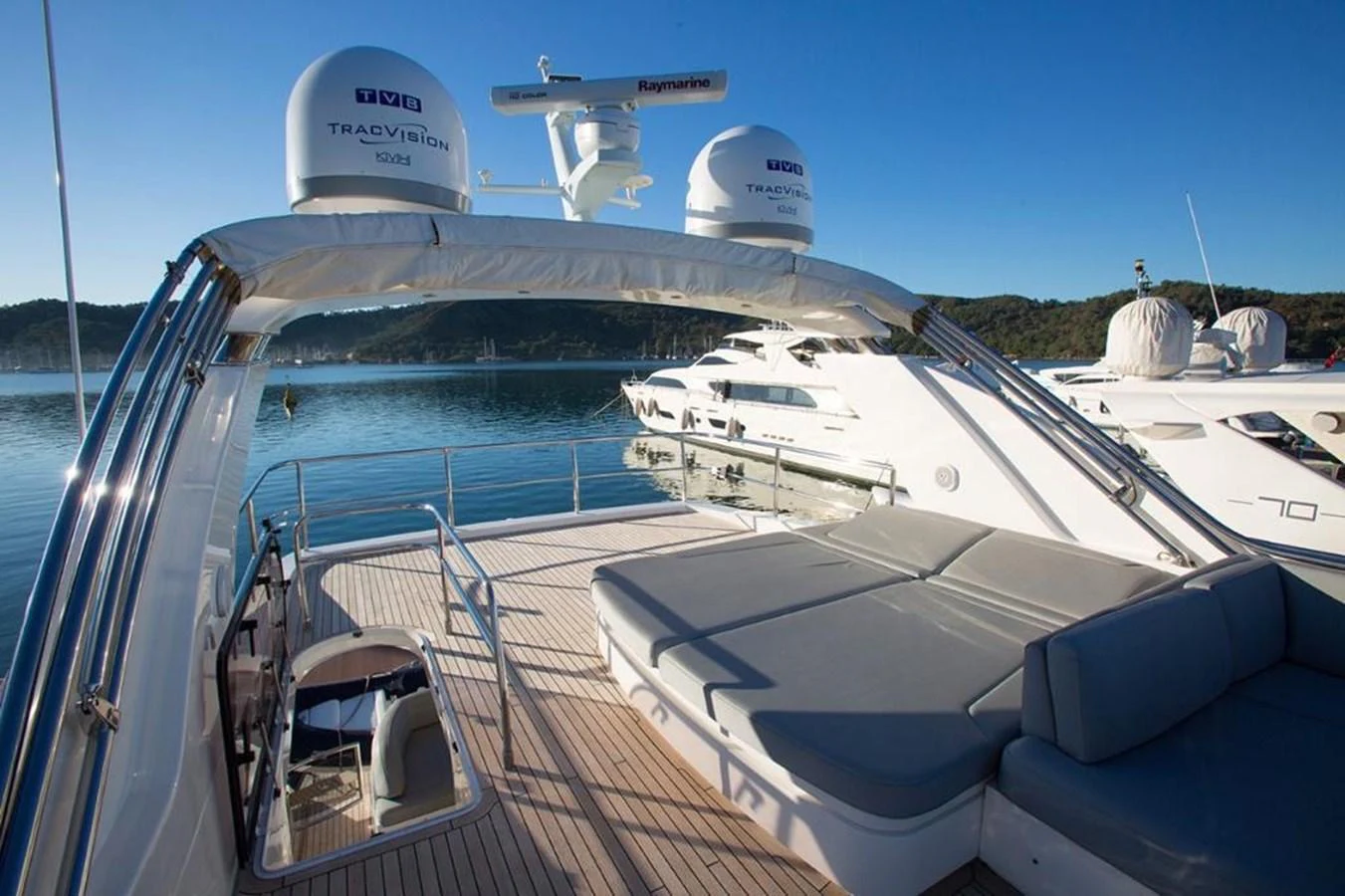 The aft deck features a spacious lounging area with comfortable seating and a beautiful view of the surrounding waters. aboard RAINBOW Yacht for Sale