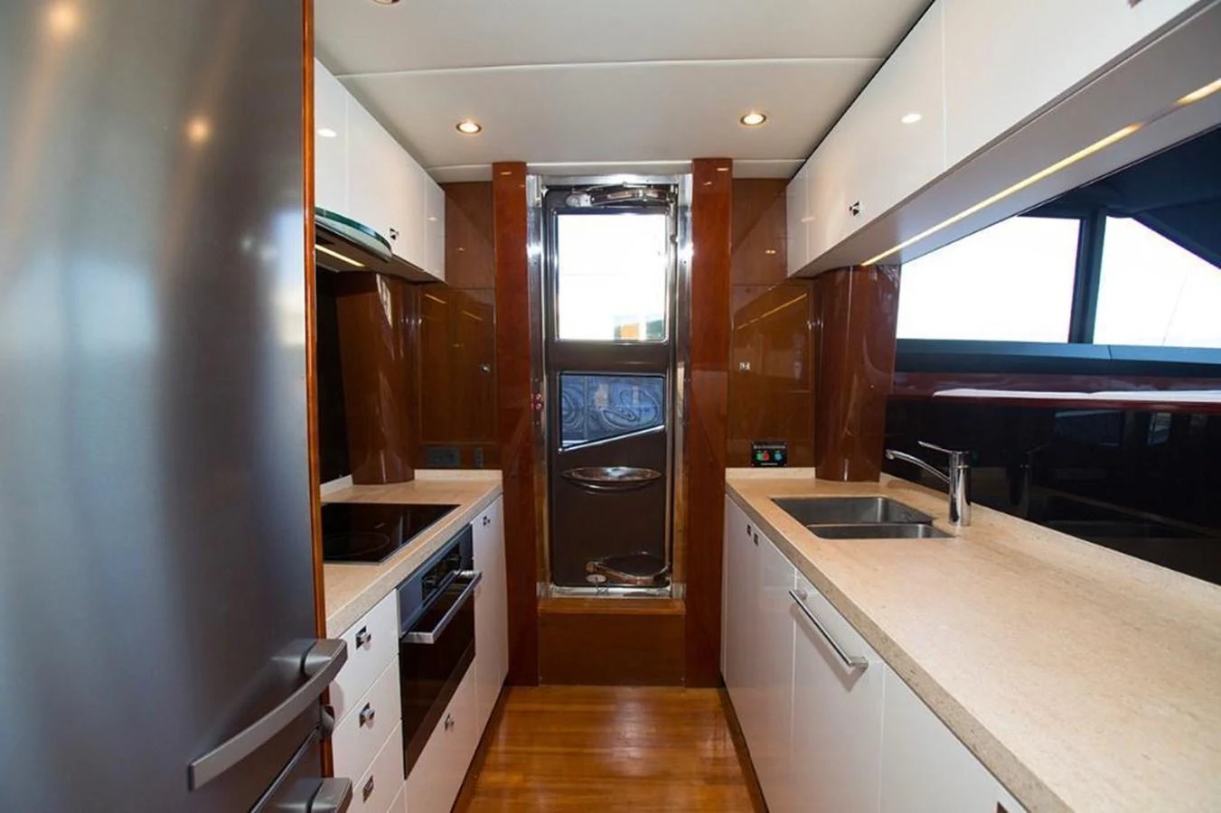 The galley features modern appliances and sleek countertops, providing a functional and stylish space for meal preparation. aboard RAINBOW Yacht for Sale