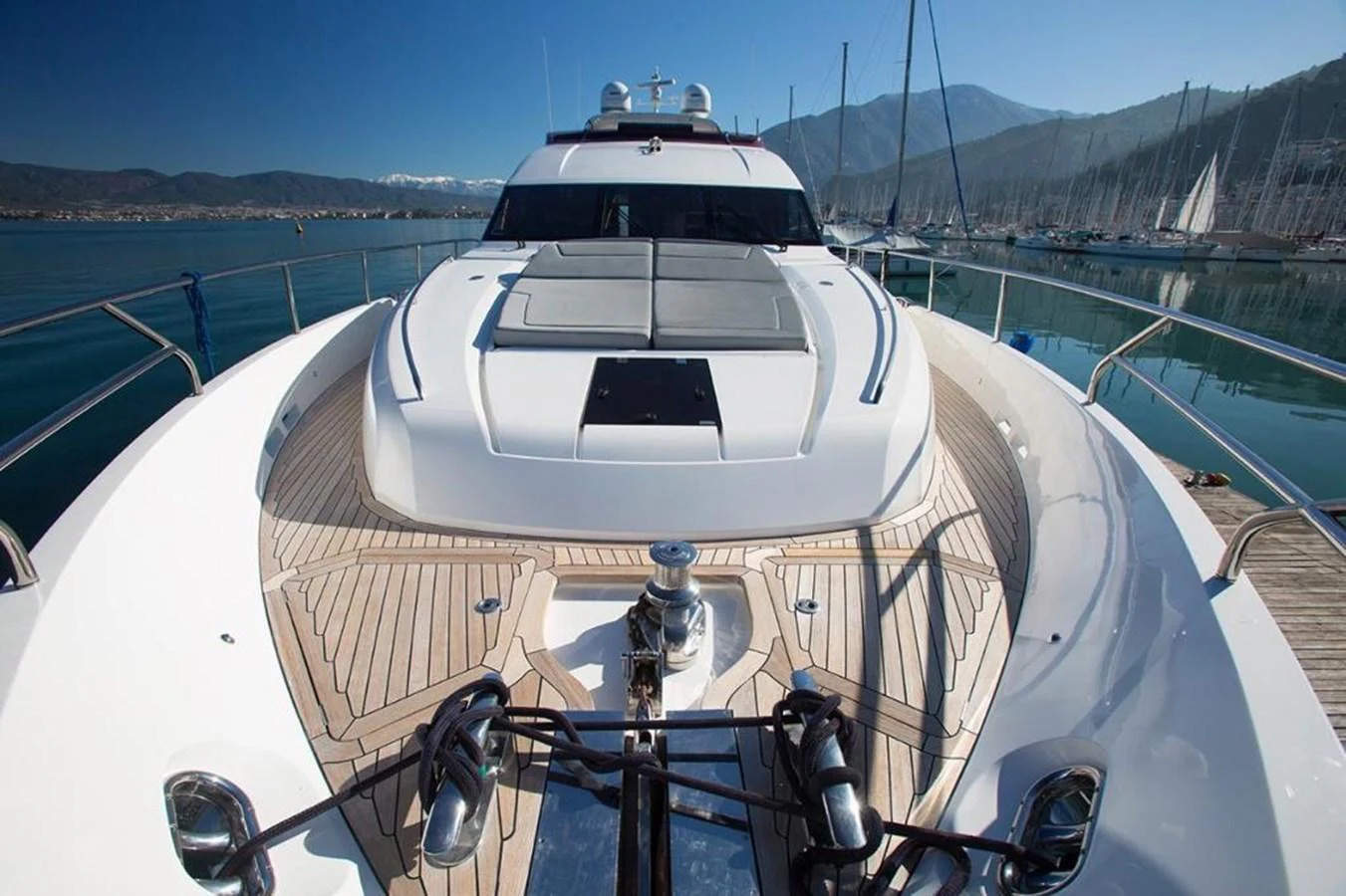 The foredeck of the yacht features spacious sun pads and a sleek design, perfect for relaxation and taking in the views. aboard RAINBOW Yacht for Sale