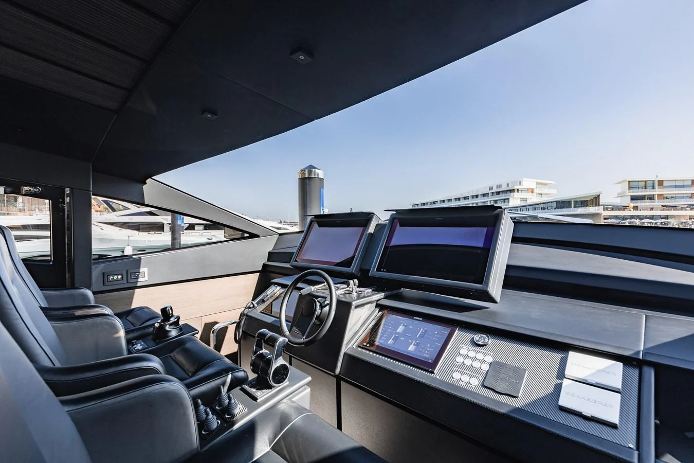 The helm station features state-of-the-art navigation equipment and luxurious seating. aboard 2021 PERSHING 8X Yacht for Sale