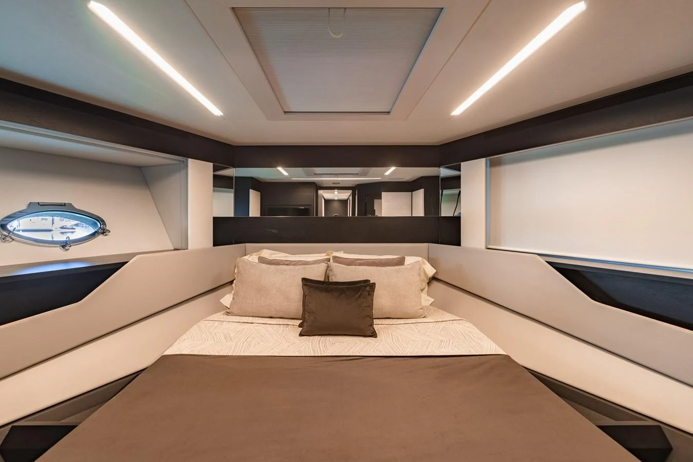 The stateroom features a modern design with sleek lines and luxurious bedding. aboard 2021 PERSHING 8X Yacht for Sale