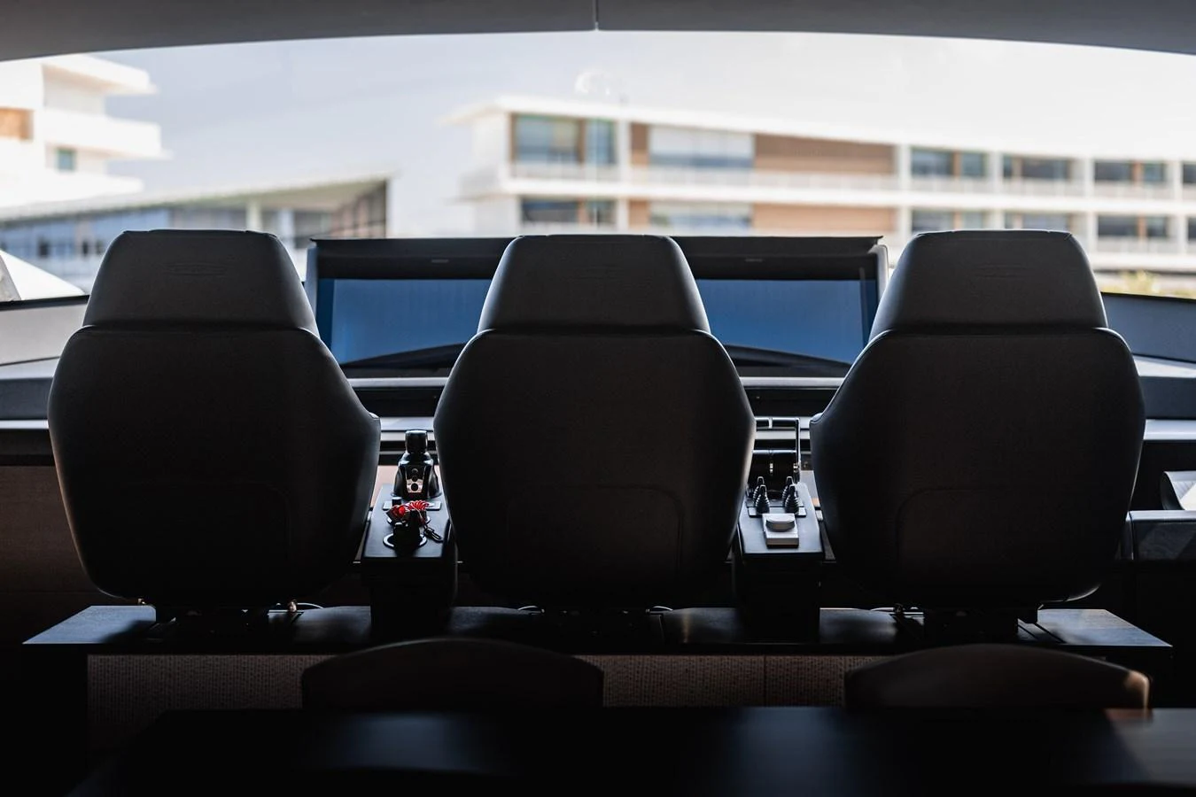 The helm station features three luxurious seats and state-of-the-art navigation equipment. aboard 2021 PERSHING 8X Yacht for Sale