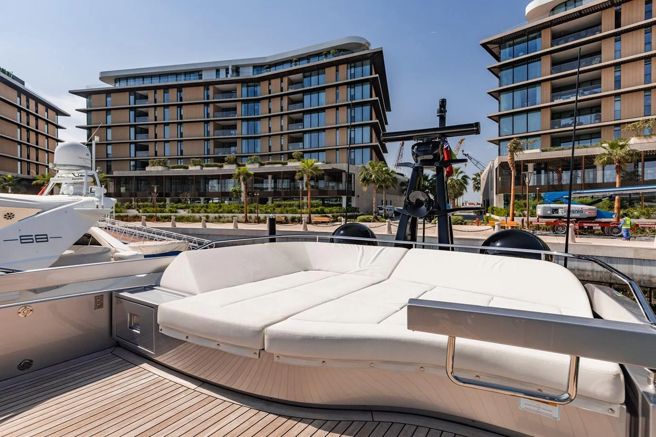 The yacht's aft deck features a spacious, sun-soaked lounging area with plush seating. aboard 2021 PERSHING 8X Yacht for Sale
